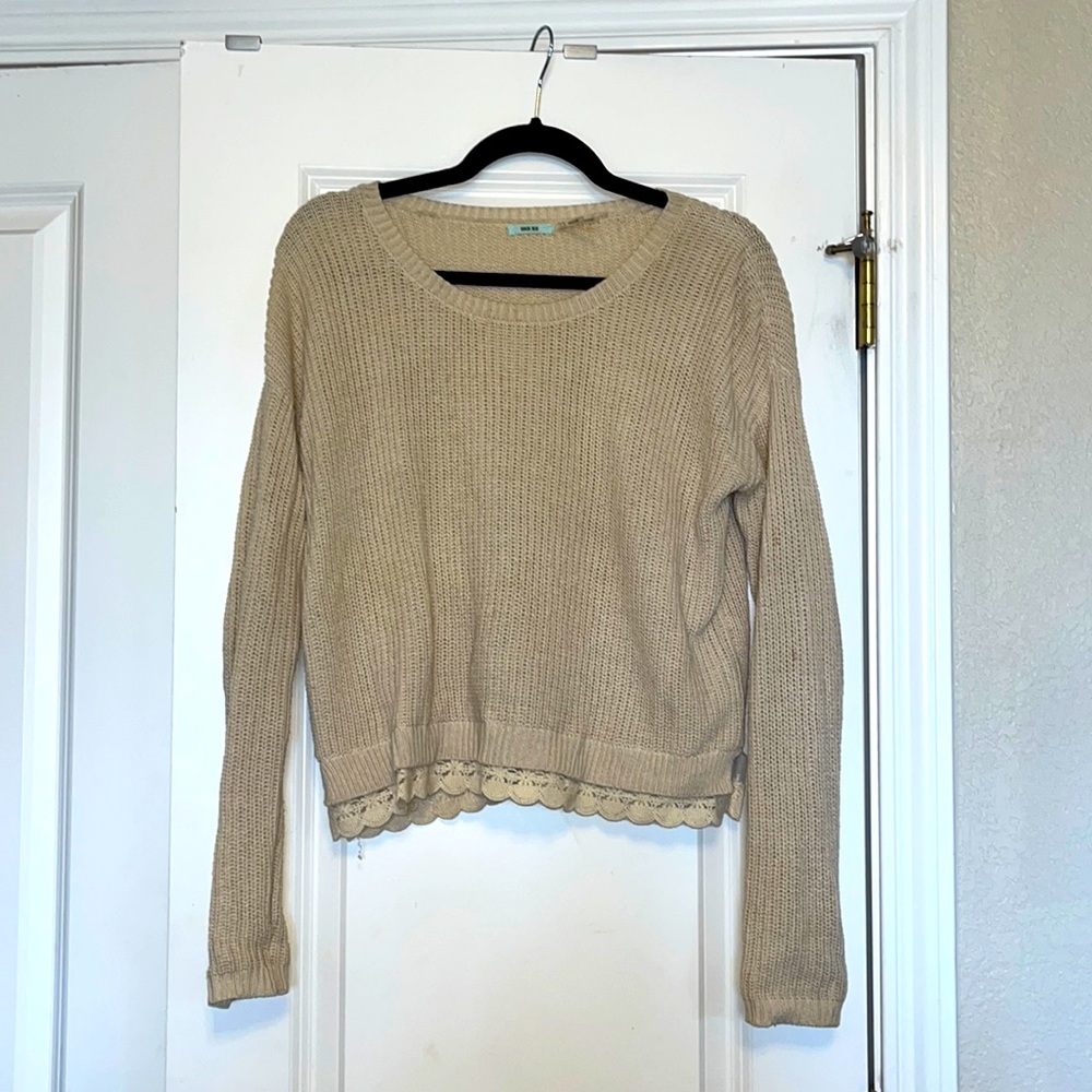 This is a Kimchi Blue knit sweater with a lace lining.
